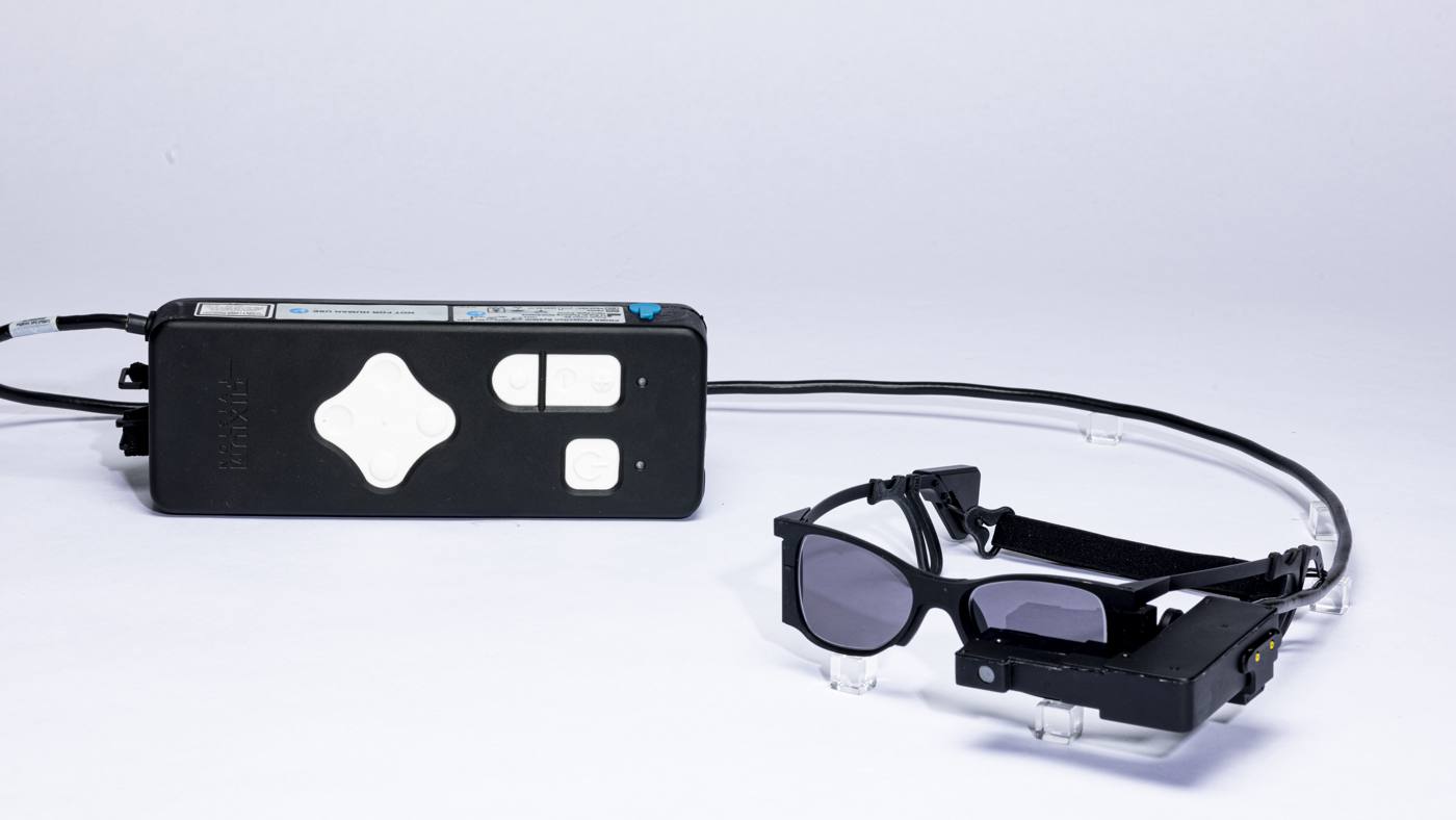 Blind patients read again with smart glasses-linked eye implant
